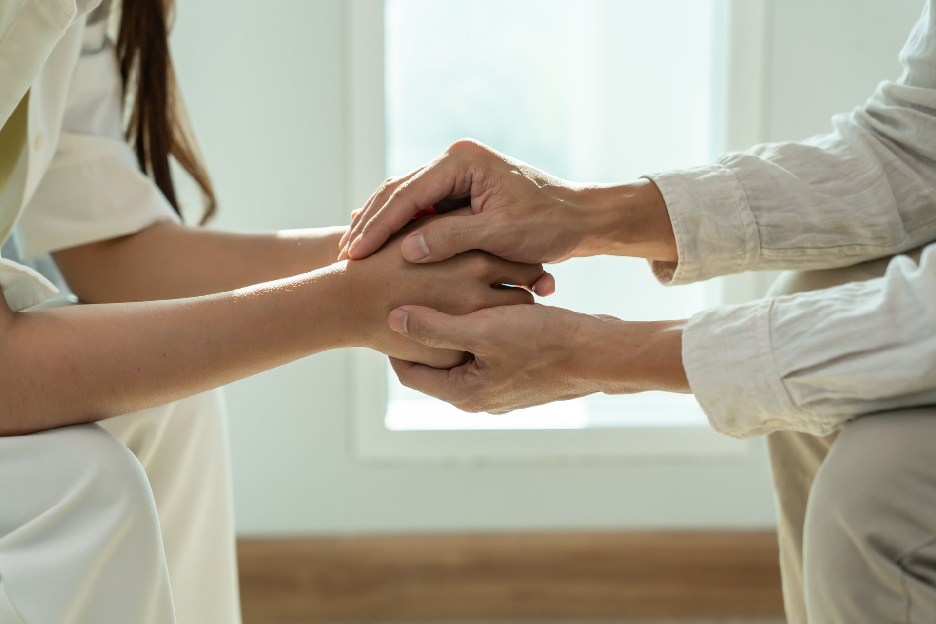psychiatrist hold hand support each while discussing family issues. doctor encourages and empathy man suffers depression. psychological, save divorce, Hand in hand together, trust, care
